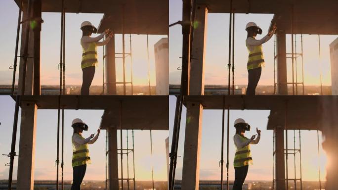 戴着VR眼镜和头盔的女检查员检查摩天大楼的建造进度，在日落时移动双手，可视化建筑物的计划。