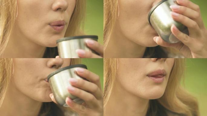 女人喝茶，保持水分平衡，皮肤缺乏水分特写