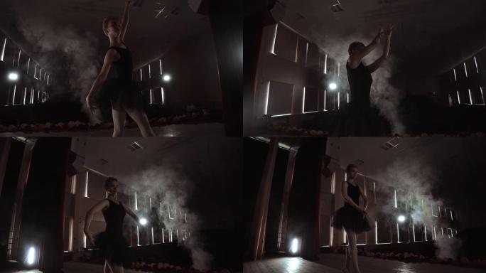 优美的芭蕾舞演员在黑暗中跳舞芭蕾舞元素，背景为灯光和烟雾，慢动作。
