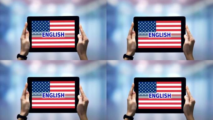 女性手握平板电脑，英语单词反对美国国旗，在线应用