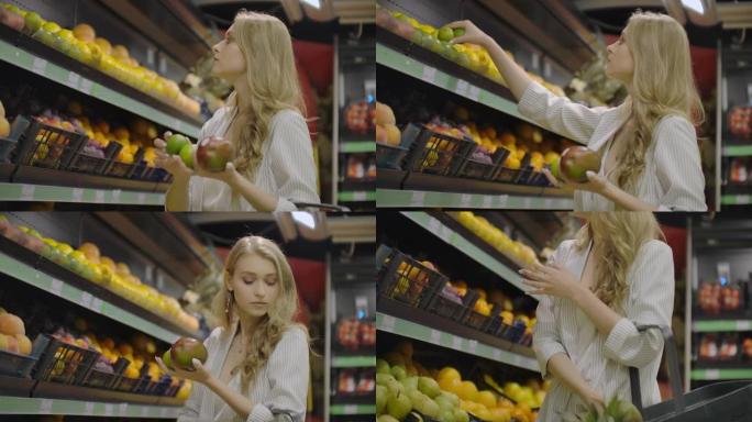 年轻女子在杂货店选择成熟的芒果。纯素食零浪费女孩在有机超市购买水果和蔬菜，并使用可重复使用的农产品袋