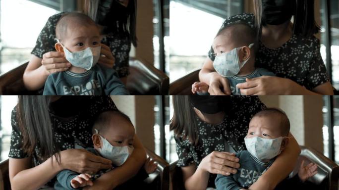 戴着污染口罩的小男孩 (2-5个月)