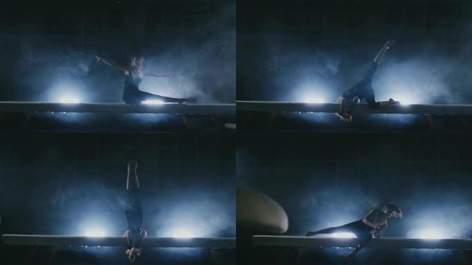 女子艺术体操。在烟雾中慢动作，女孩在平衡木上表演奥林匹克计划的复杂元素