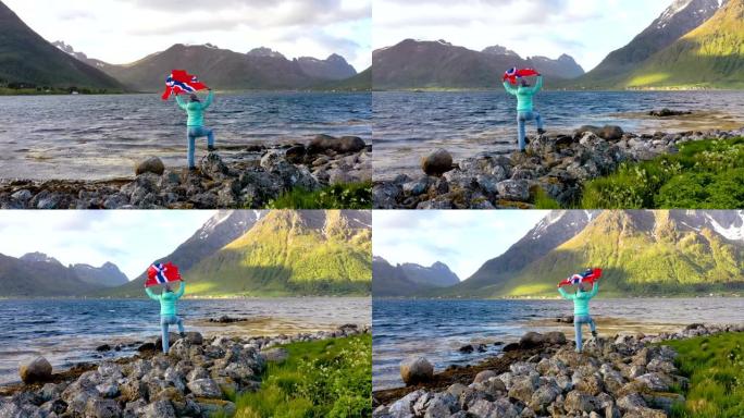 在大自然的背景下挥舞着挪威国旗的女人