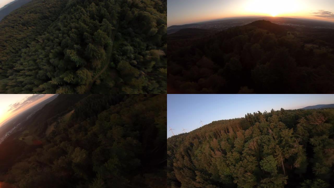 空中高速无人机拍摄山地车手在森林中骑行