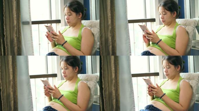 胖女人玩手机智能手机打字线上购物刷微信短