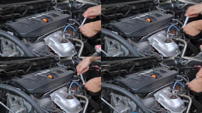 他正在自己维护自己的汽车。