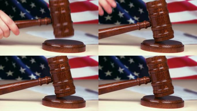 法官手击打木槌，美国国旗背景，美国法律制度，司法