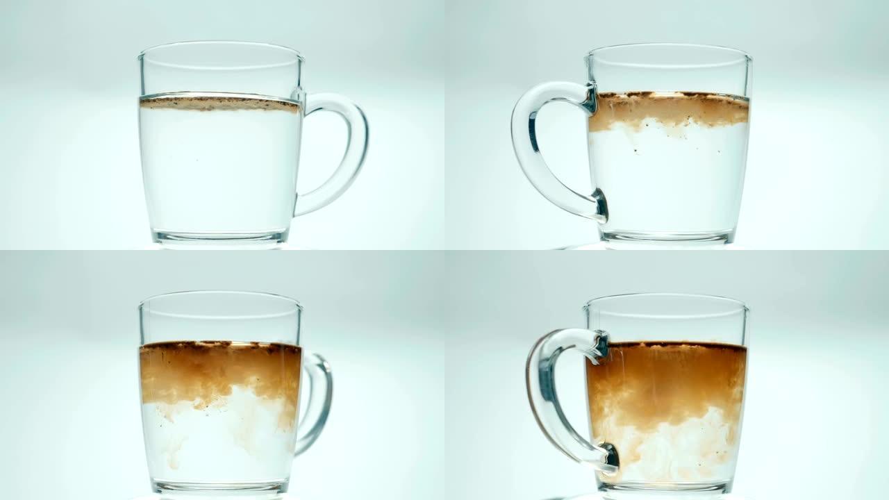 用开水从水壶倒入玻璃杯中，放入汤匙咖啡