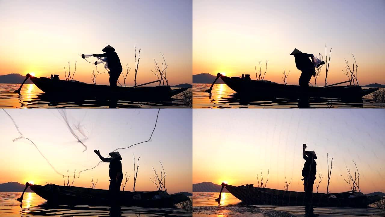 高清慢动作: 泰国日落时分在长尾船上钓鱼的渔民
