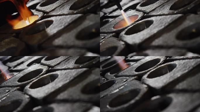 一个人用火炬在铝阳极中钎焊金属 (制造)
