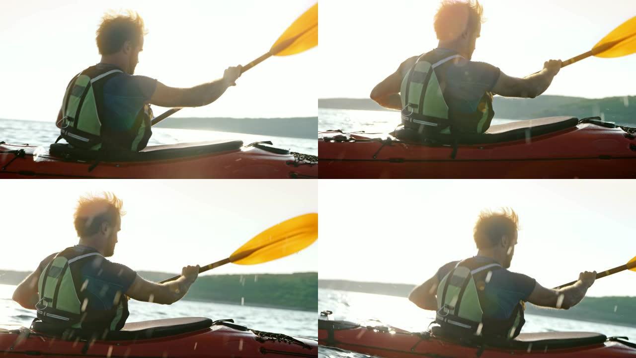 SLO MO TS男子在阳光下在海上划独木舟