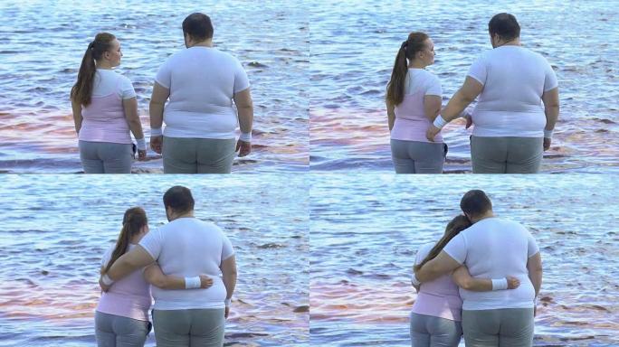 肥胖的女人拥抱她的胖男朋友，享受平静的湖景