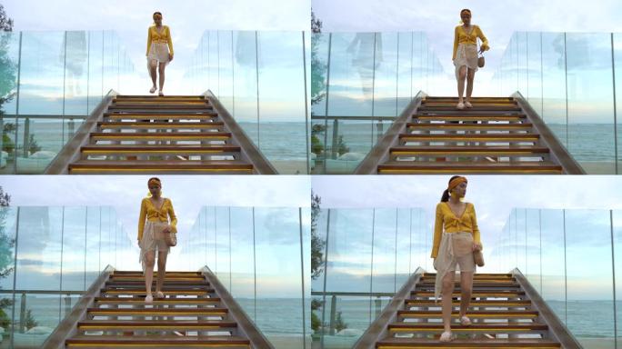 4k镜头美女走在玻璃楼梯上