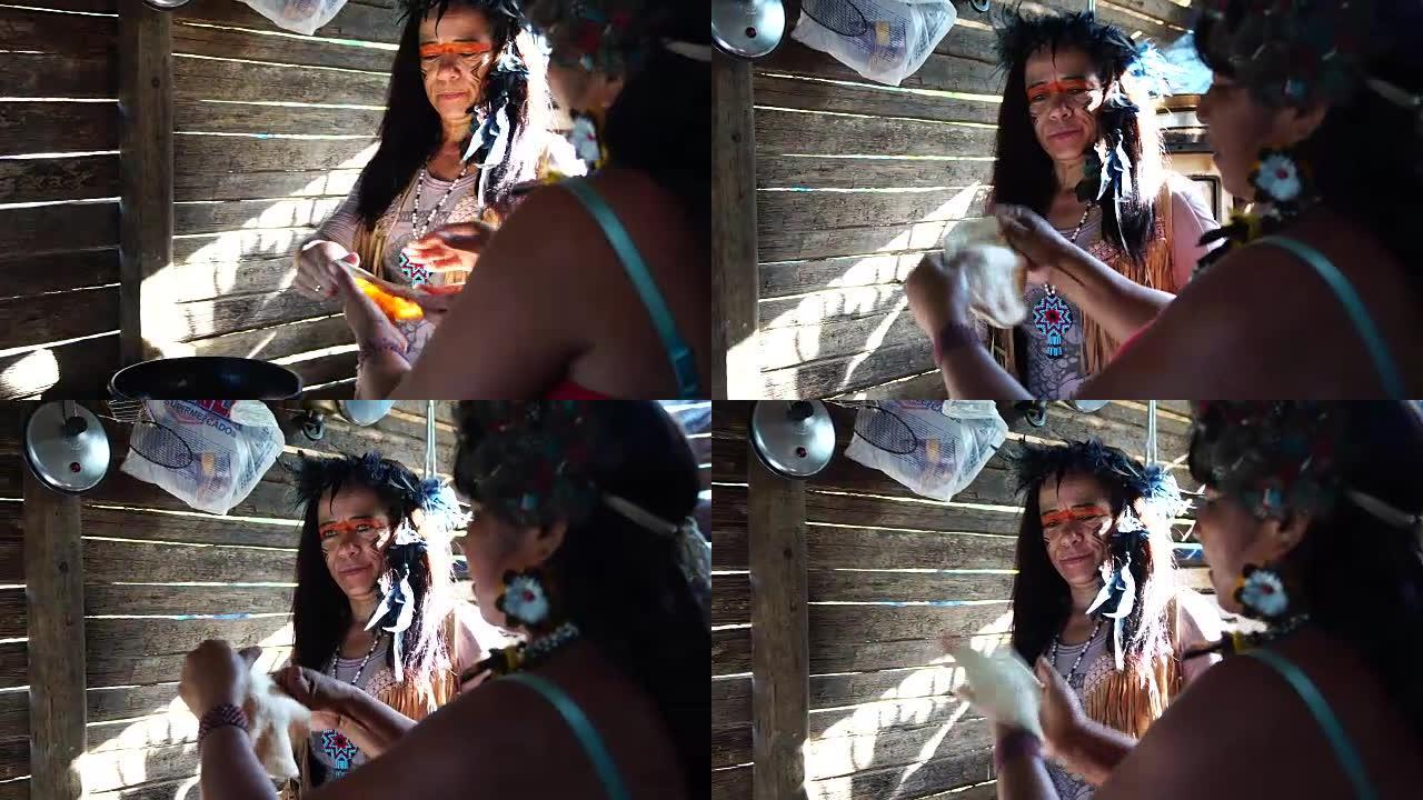 巴西土著妇女，来自瓜拉尼族，烹饪 “西帕”