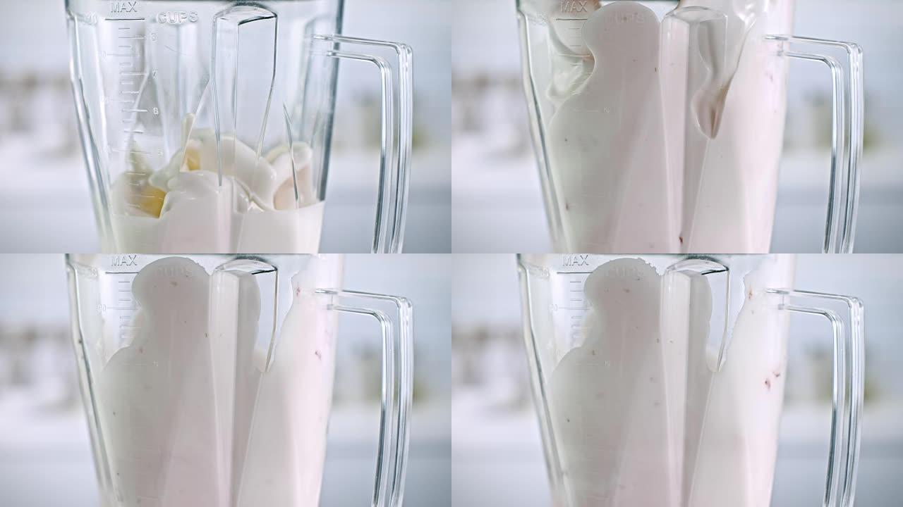 SLO MO牛奶和巧克力糖浆在搅拌罐中旋转