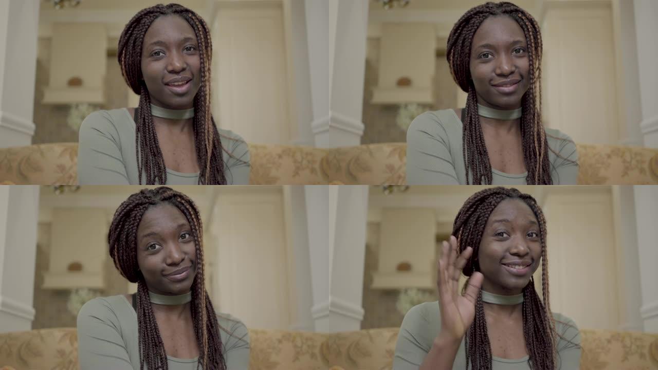 年轻漂亮的非洲裔美国女性在社交网络上通过笔记本电脑视频通话的镜头说话的肖像