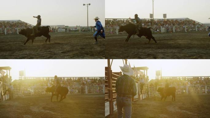 慢动作拍摄的公牛骑手在挤满人的体育场参加公牛比赛，而牛仔竞技小丑在日落时观看