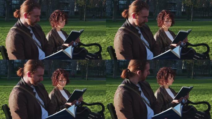 男人和女人在公园里一起读书