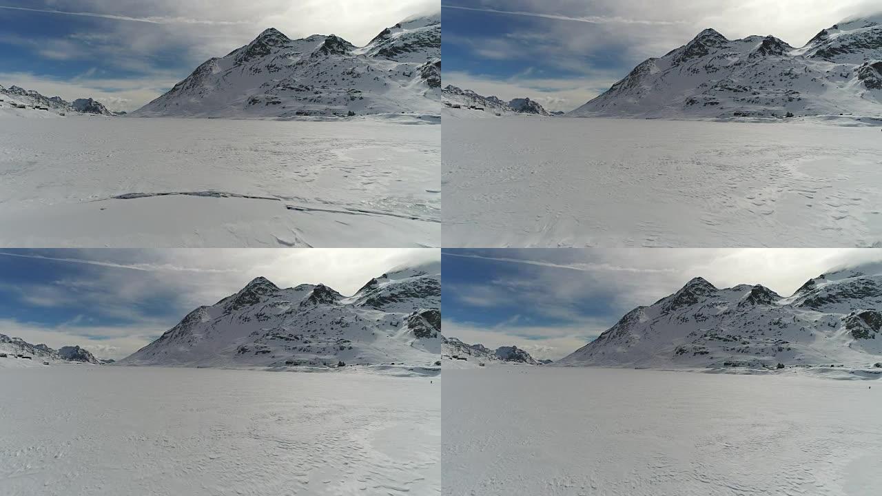 无人机飞越冰冻的山湖