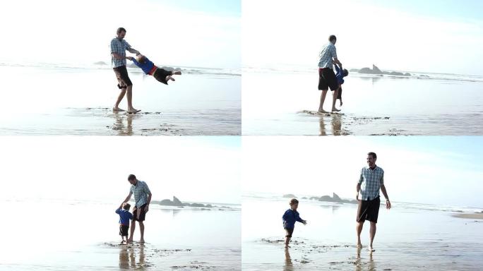 父子在海滩玩耍父子在海滩玩耍沙滩