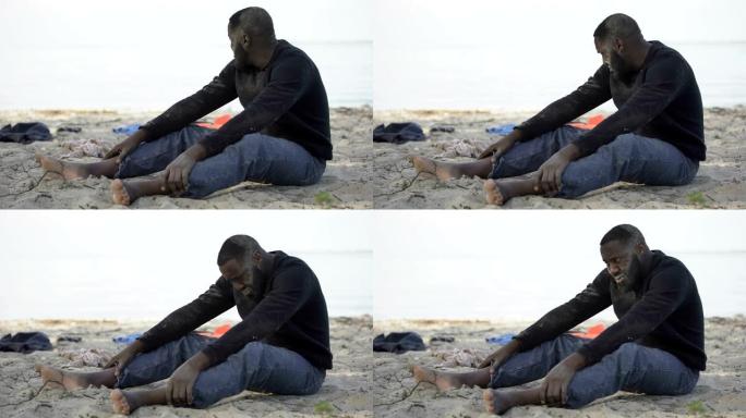 黑人在岸上哭泣，陷入困境的难民幸免于难，灾难