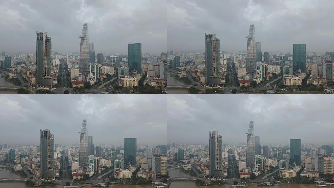 4k无人机视频飞越胡志明市市中心中心的胡志明市天际线和摩天大楼。越南胡志明市西贡河的城市景观全景