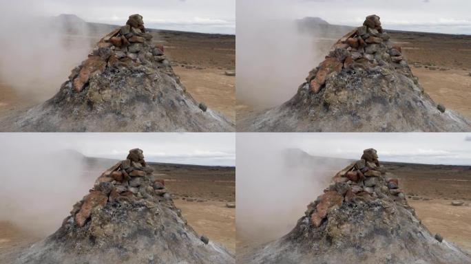 热蒸汽在崎的火山山坡上逸出岩石堆