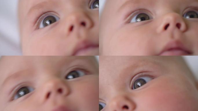 新生婴儿的无辜眼睛特写，婴儿环顾四周，生命的开始