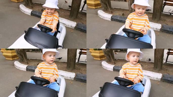 小男孩在公园里骑玩具车