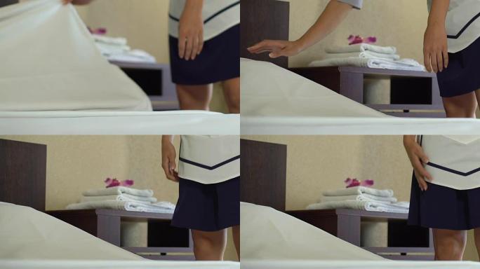 早上五星级酒店的女仆铺床，为客户提供高质量的服务