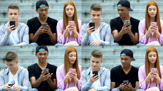 朋友在户外的手机上聊天社交网络，快乐的青少年分享新闻