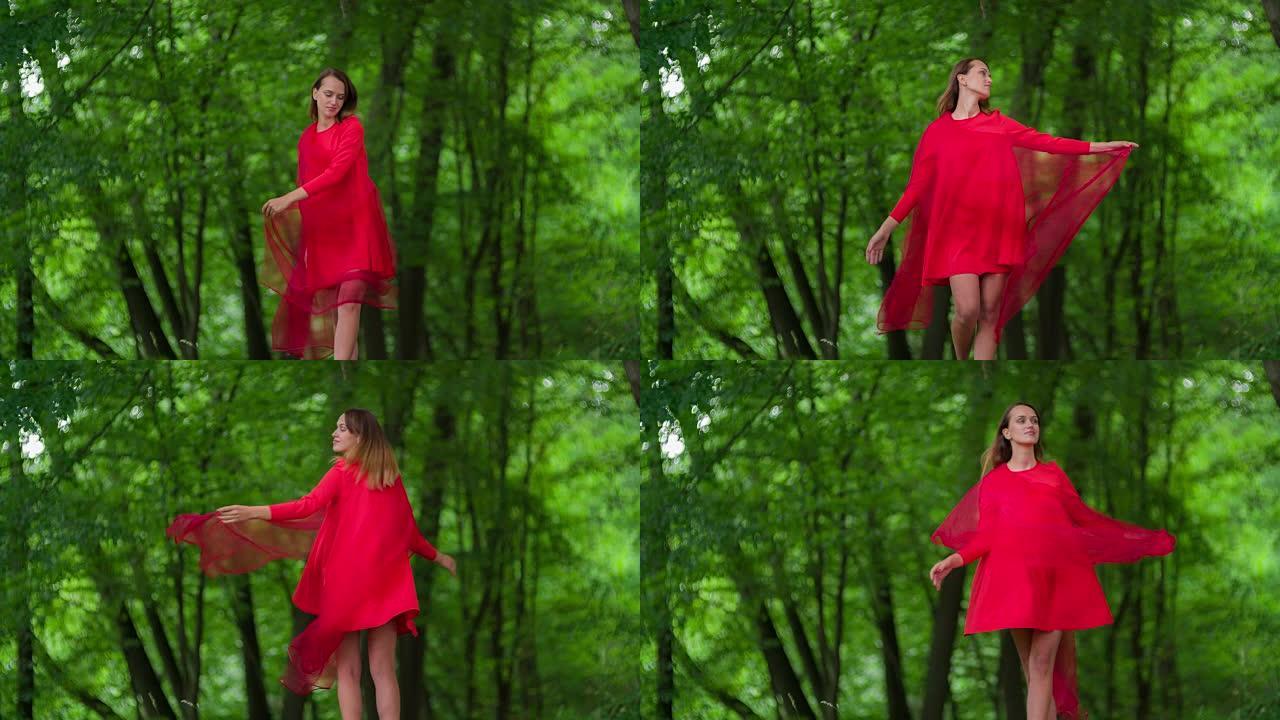 穿着红色连衣裙的女人在森林里旋转