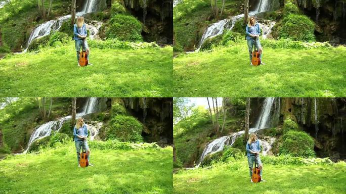 夏天在瀑布边弹吉他的年轻女子