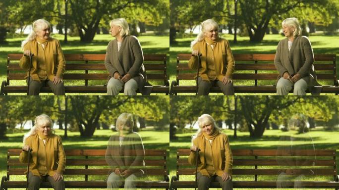 孤独的老太太想念她的好朋友，坐在公园里，不快乐的养老金领取者