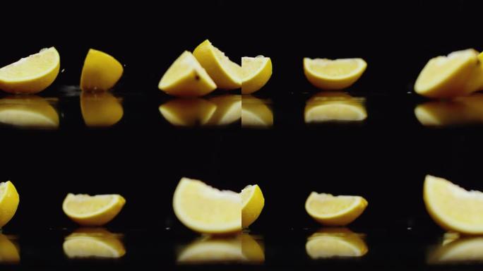 一个多汁的切成薄片的黄色柠檬落在玻璃杯上，在黑暗的背景上慢动作飞溅着水。