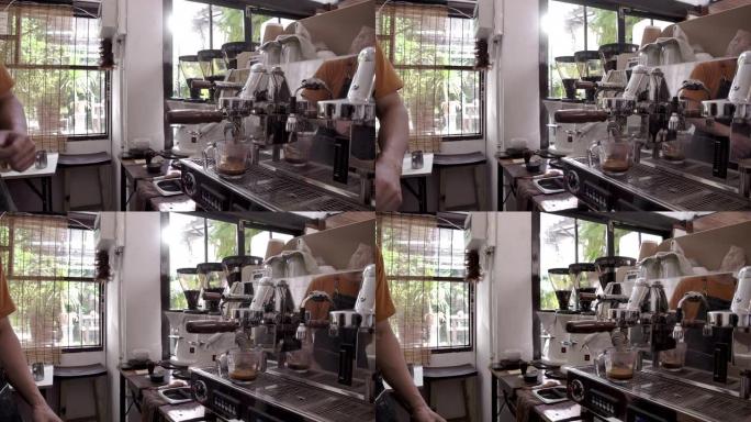 咖啡店老板小企业他正在他的商店里用咖啡机煮咖啡。
