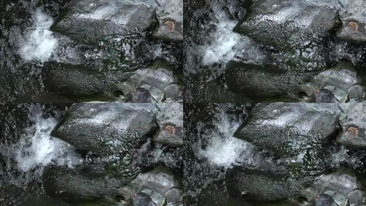 在岩石上层叠水的慢动作镜头