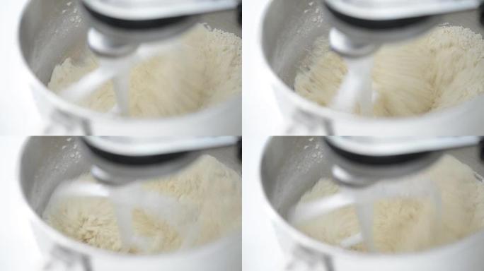 搅拌机混合面粉和制作面团的宏观场景