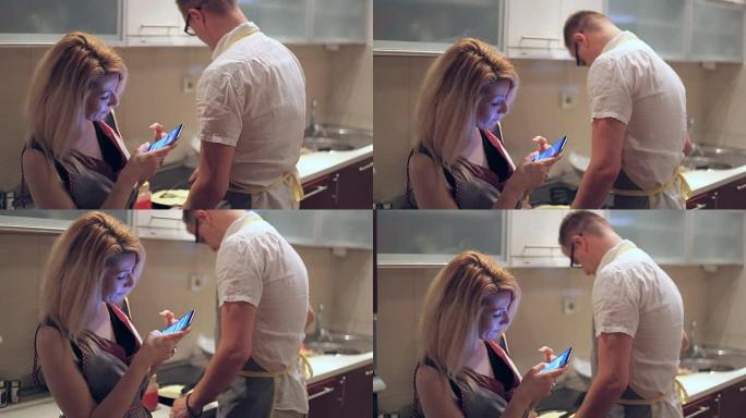 男人在做饭，而女人在输入短信