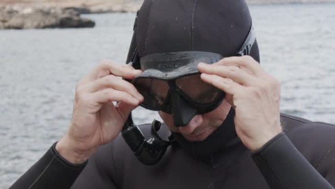 潜水员戴上面具的慢动作镜头