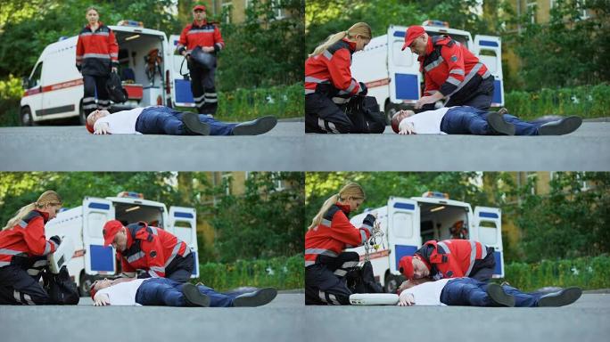 救护人员跑向躺在道路上的男子，在车祸现场急救