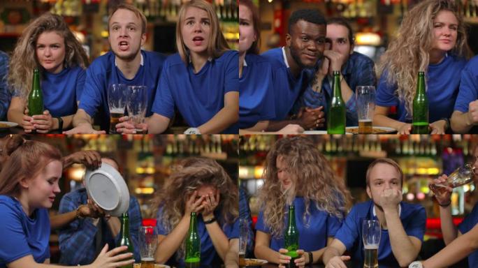 一群近距离的球迷在酒吧里情绪激动地观看电视转播的体育赛事，他们喝着啤酒，穿着不同种族的蓝色t恤的男男