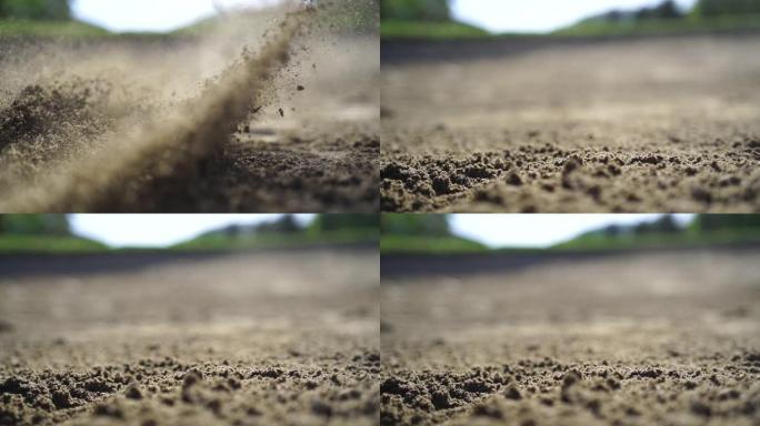 高尔夫球杆在沙坑中挥杆的细节