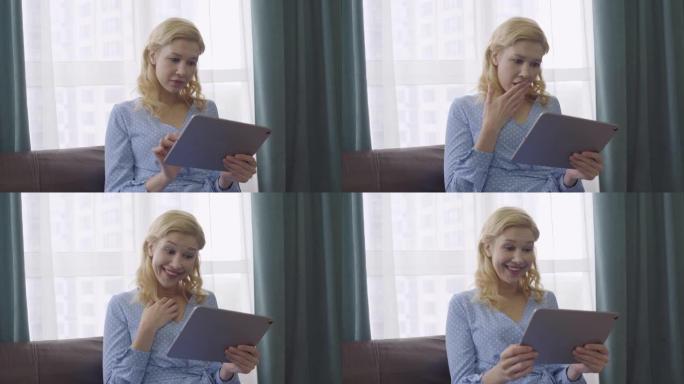 快乐的女性在平板电脑上阅读信，感到惊讶，好消息，惊喜
