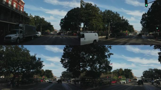 沿着新奥尔良市中心 (法国区) 的迪凯特街行驶，左侧是杰克逊广场 (公园)，早上是马车和活橡树