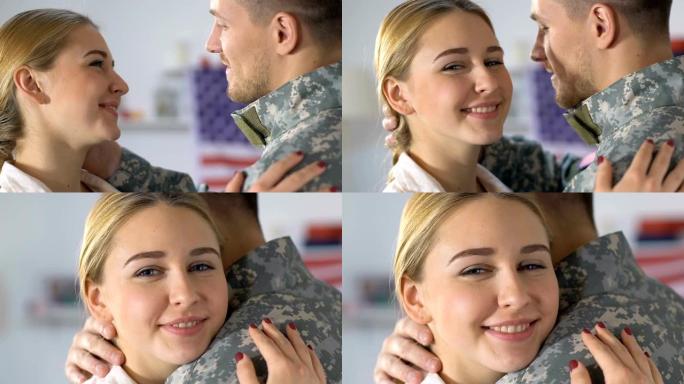 快乐的女友看着镜头拥抱军官，退伍军人归来