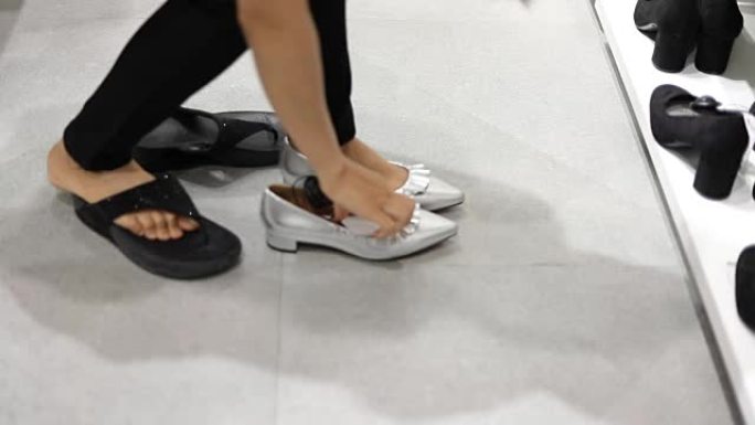 女人在商店试鞋体验试穿鞋子搭配尝试新款鞋