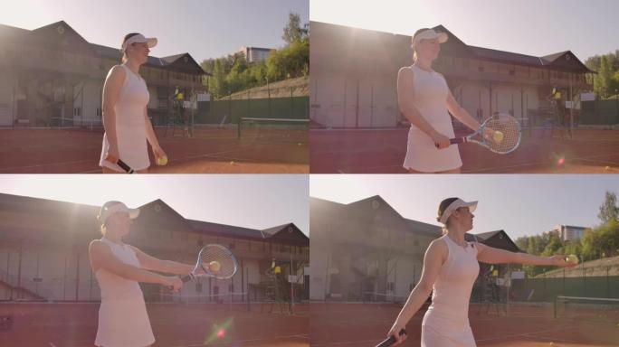 年轻漂亮的女孩打网球。一个穿着白色运动服的女人专业训练网球。年轻漂亮的女孩打网球。网球供应