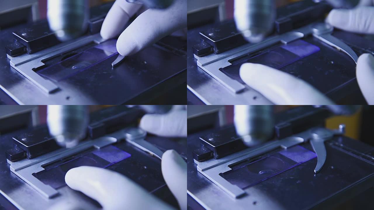 科学家用显微镜的手在实验室里特写镜头